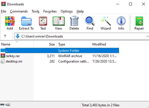 Interface de WinRAR sous Windows affichant le dossier Downloads et une archive RAR